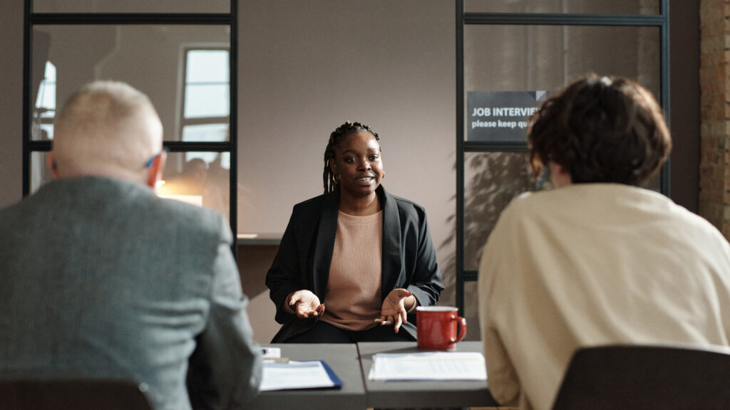 An applicant in an interview with recruiters